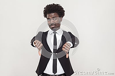 Sadness afro man showing dislike and looking at camera. Stock Photo