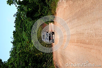 Safari jeep on dirt road Stock Photo
