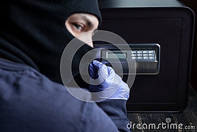 Safe break-in, dark colors. Lock opening. Security, home protection, risk minimizing concepts Stock Photo
