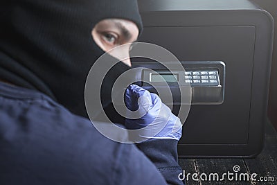 Safe break-in, dark colors. Lock opening. Security, home protection, risk minimizing concepts Stock Photo