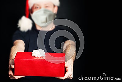 Safe delivery. Christmas present gift box in male hands Stock Photo