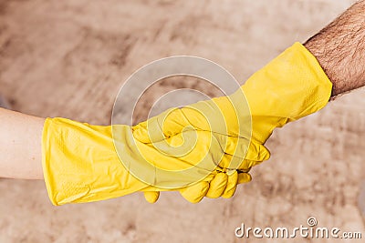 Safe handshake during a pandemic virus - hands with rubber gloves Stock Photo