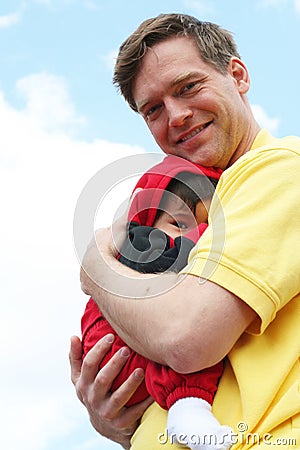 Safe and Sound in Dad's arms Stock Photo