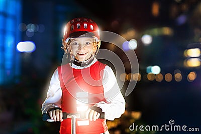 Safety on dark street. Kids reflective vest Stock Photo