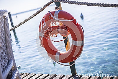 Safety on the dock: Red Lifesaver at Lake Garda Stock Photo