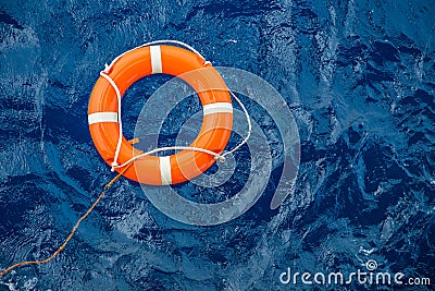 Safety equipment, Life buoy or rescue buoy floating on sea to rescue people from drowning man Stock Photo