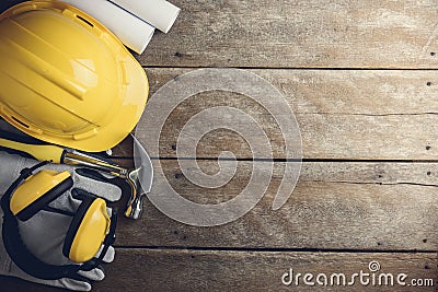 Safety equipment and tool kit on wooden background Stock Photo