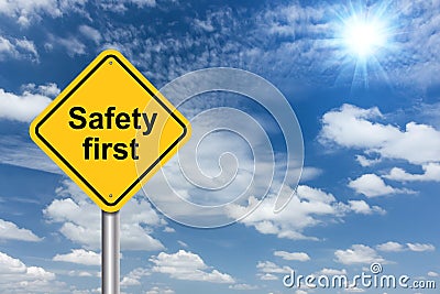 Safety first sign banner and clouds blue sky Stock Photo