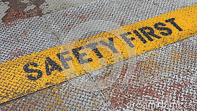 Safety First Sign on caution strip. Stock Photo