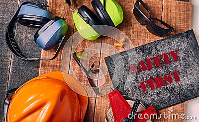 Safety first sign with personal protective equipment Stock Photo