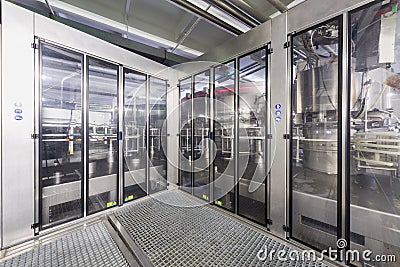 Safety guards with doors in the shop of brewery Ochakovo Editorial Stock Photo