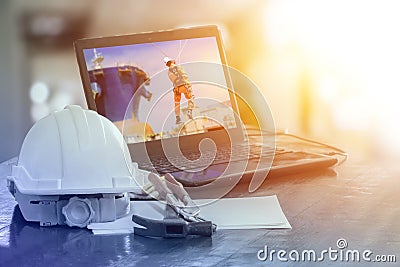 Safety helmet put on the table, high vocational Training. Stock Photo