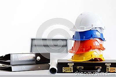 Safety helmet on table in office , engineer concept Teamwork of Stock Photo