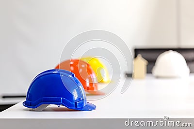 Safety helmet on table in office , engineer concept Teamwork of Stock Photo