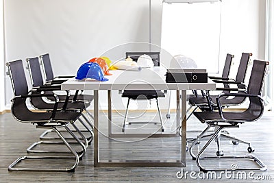 Safety helmet on table in office , engineer concept Teamwork of Stock Photo