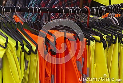 Safety Jackets and Trousers on hangers Stock Photo