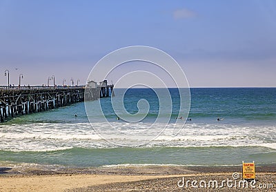 Safety no surf warning sign on the beach in San Clemente, tourist destination in California USA, pier in the background Editorial Stock Photo