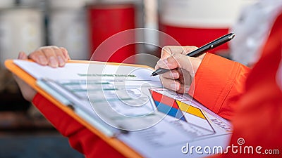 Checking on the chemical hazardous material form. Industrial safety working. Stock Photo