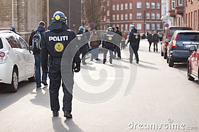 Safety, riot and protest with police officer in city for law enforcement, protection or security. Brave, uniform and Editorial Stock Photo