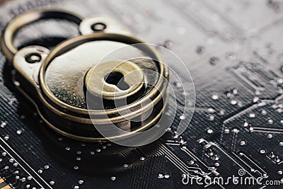 Safety and security, data encryption concept, pad lock on computer circuit board with solder, technology to encode online Stock Photo