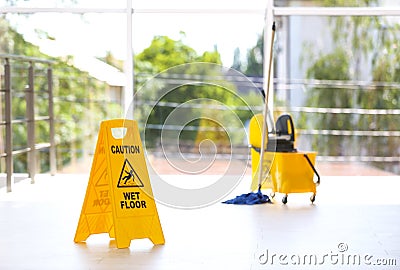 Safety sign with phrase Caution wet floor Stock Photo