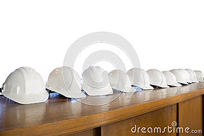 Safety white helmet row isolated on white background Stock Photo