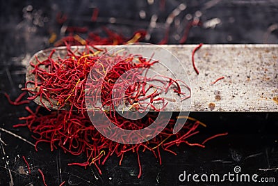 Saffron space threads in vintage knife Stock Photo