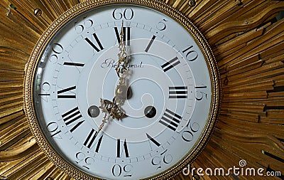 Vintage Berthoud clock face close up with roman numerals hands and brass surround. Editorial Stock Photo
