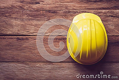 Safty helmet placed on a wooden table Stock Photo