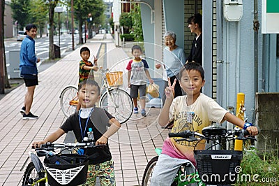 Saga, Japan:September 1,2018 - Portrait group of Japanese boys with their bicycles after school. Liefstyle of Japanese children in Editorial Stock Photo