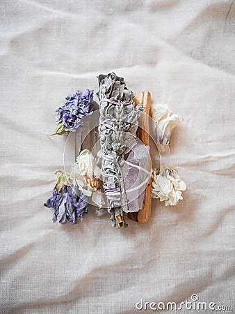 Sage bundle with crystals and flowers Stock Photo