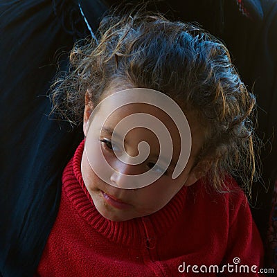 Sahara Desert, Morocco - November 2019: A portrait a young girl of nomad family in Sahara Desert, Morocco Editorial Stock Photo