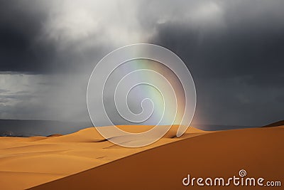 Sahara desert sand dunes with rainbow against dark, cloudy, rainy sky Stock Photo