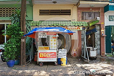 SAIGON, VIETNAM - October 16, 2014: Local fast food restaurant on a small street, Saigon, Vietnam. Editorial Stock Photo