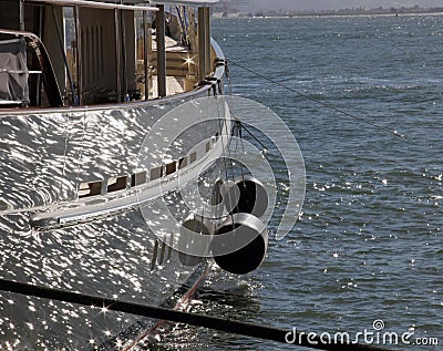 Sail boat with ocean glistening reflection Stock Photo