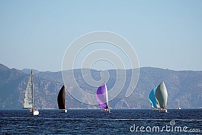 Sail Yacht racing in the Mediterranean sea in Turkey. Several sailing yachts in a beautiful bay. Stock Photo