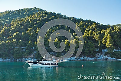 Sailboat in Agnontas bay at sunset, Skopelos island Stock Photo