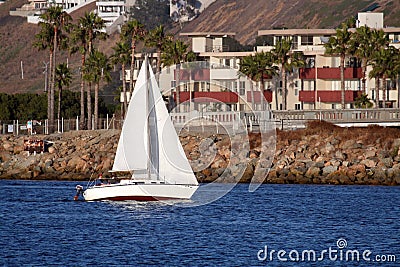 Sailboat along the coast Stock Photo