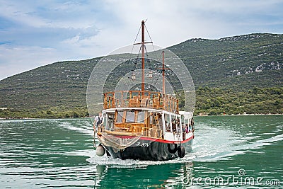 Sailboat comes near to Mali Ston Editorial Stock Photo