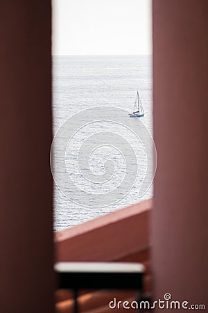Sailboat heading for the open sea in summer Stock Photo
