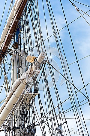 Sailboat masts, rigging and rolled up sails Stock Photo
