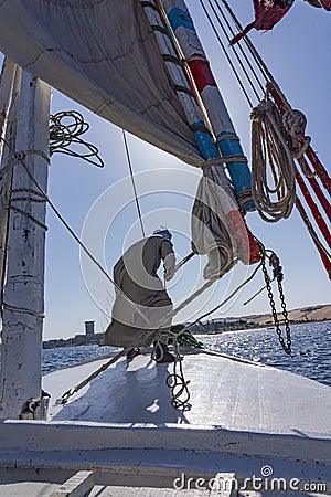 The sailboat - Old Man - Sailor - Aswan - Egypt - Nile River Editorial Stock Photo