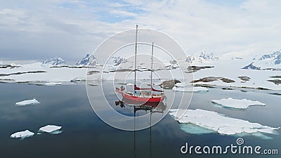 Sailboat travel in antarctica iceberg ocean aerial Stock Photo