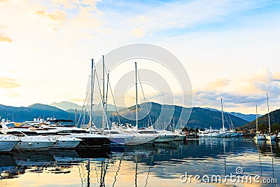 Sailboat and yachts. Port in Mediterranean sea at sunset. Stock Photo