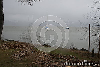Sailboats on lake during storm Stock Photo