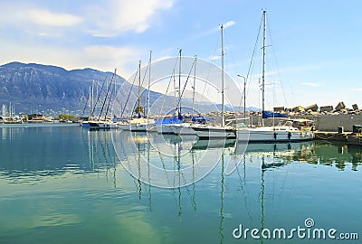 Sailboats reflected on sea at Kalamata Greece Stock Photo