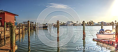 Sailboats in a riverway that leads to the ocean on Isle of Capri near Marco Island Stock Photo