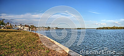 Sailboats in a riverway that leads to the ocean on Isle of Capri near Marco Island Stock Photo