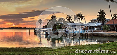 Sailboats in a riverway that leads to the ocean on Isle of Capri near Marco Island Stock Photo