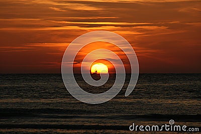 Sailing boat captured in sunset at Vlieland Stock Photo